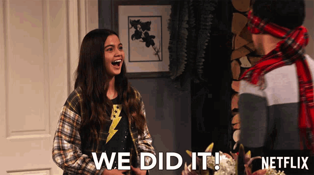 a girl with a lightning bolt shirt says we did it next to a man