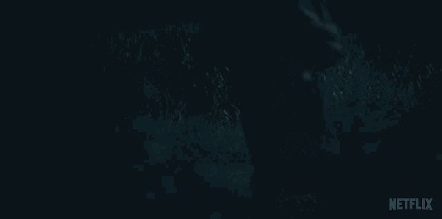a dark background with a netflix logo on the bottom right