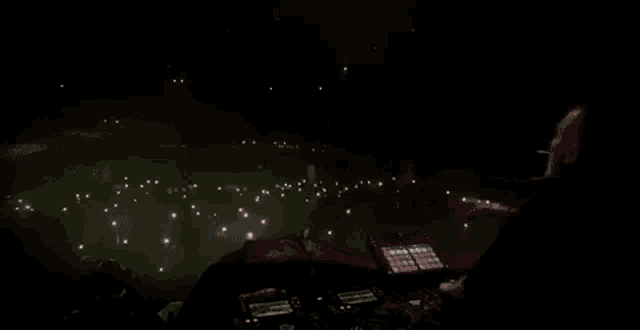 a dj playing music in front of a crowd at a concert