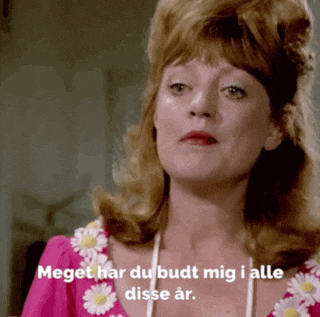 a woman in a pink dress says meget har du budt mig i alle disse ar.
