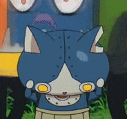 a blue and white cartoon cat with yellow eyes is standing in a field