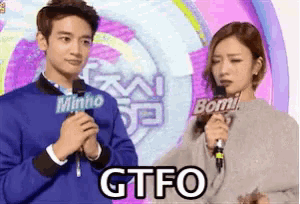 a man and a woman standing next to each other with gtfo written on the bottom of the image