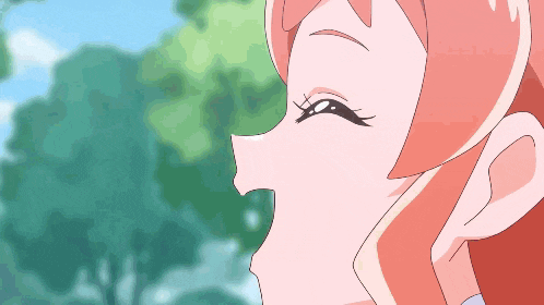 a close up of a girl 's face with a blue sky in the background