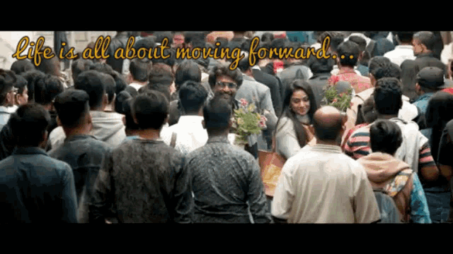 a crowd of people with the words life is all about moving forward on the bottom