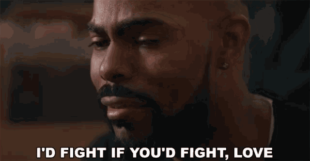 a man with a beard is saying `` i 'd fight if you 'd fight , love ''