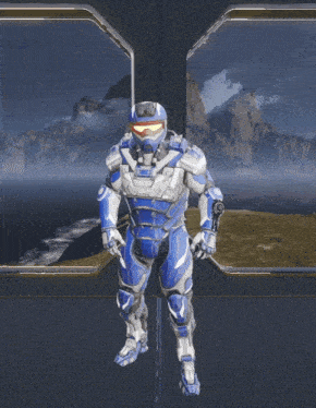 a man in a blue and white armor is standing in front of a window with his arms outstretched
