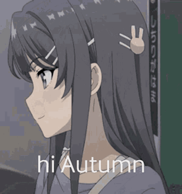 a girl in a purple shirt is holding a piece of paper with the words hi autumn written on it .