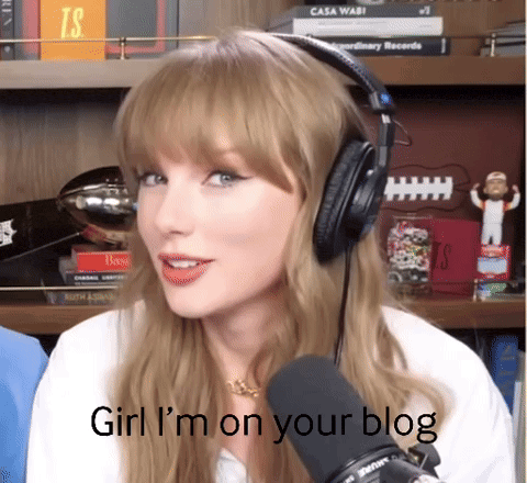 a woman wearing headphones says girl i 'm on your blog in front of a microphone