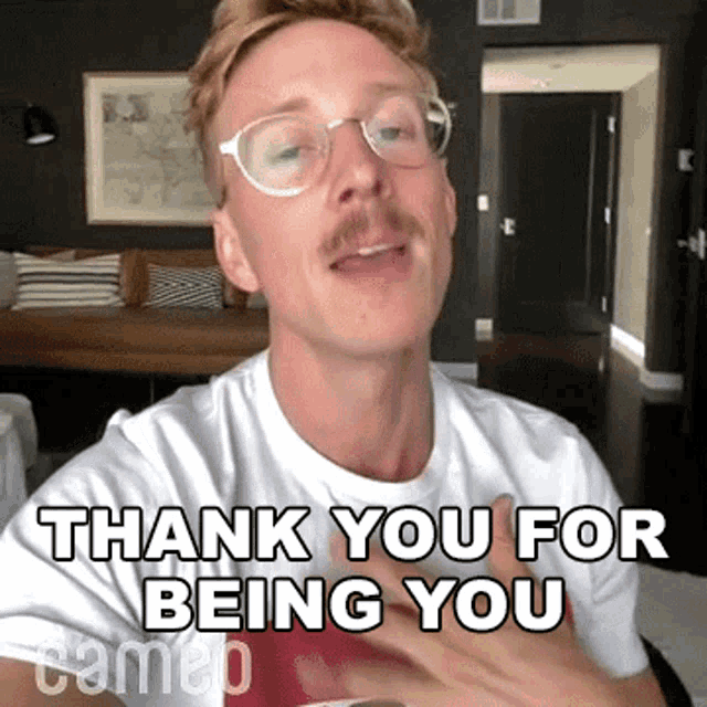 a man with glasses and a mustache is saying thank you for being you