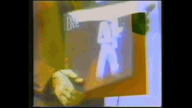 a blurry image of a person holding a sign that says a on it