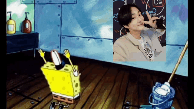 a cartoon of spongebob cleaning the floor with a picture of a man behind him