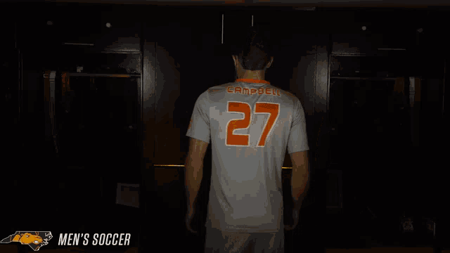 a man in a striped shirt with the number 27 on the front