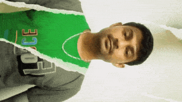 a man wearing a green t-shirt with the word joe on it