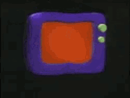 a blurred image of a person 's face with a purple and orange object in the background