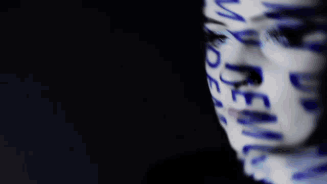 a close up of a woman 's face with the word monsa written on it