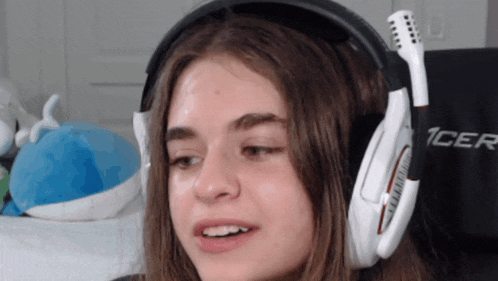 a girl wearing a pair of headphones that say 1cer