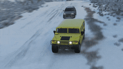 a yellow hummer is driving down a snow covered road
