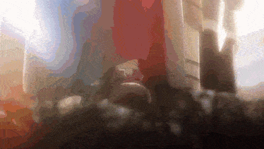 a blurry image of a person standing in front of a building