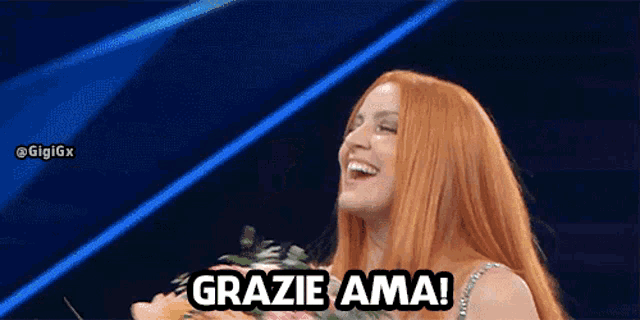 a woman with red hair holds a bouquet of flowers and says " grazie ama "