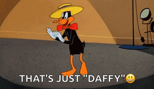 a cartoon duck wearing a hat and gloves is dancing on a stage and saying `` that 's just daffy ''