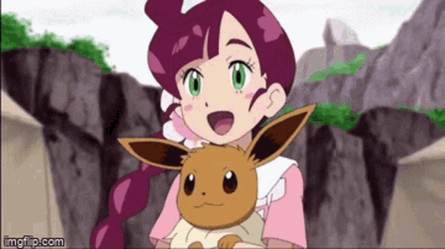 a girl in a pink dress is holding a brown eevee .