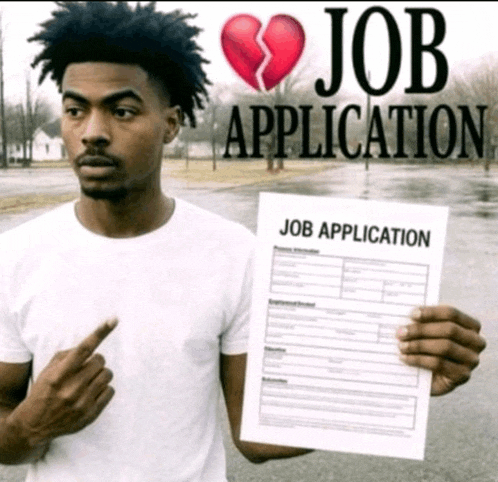 a man is holding a job application and pointing at it