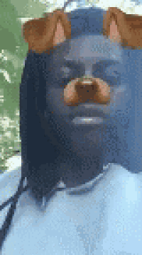 a person is wearing a snapchat filter that looks like a bear .