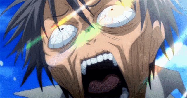 a close up of a person 's face with their mouth open .