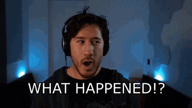 a man wearing headphones says " what happened " in front of him