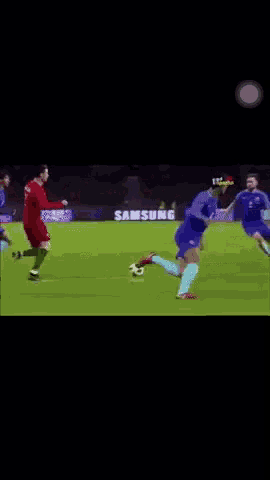 a soccer player wearing a blue shirt with the word chelsea on the back