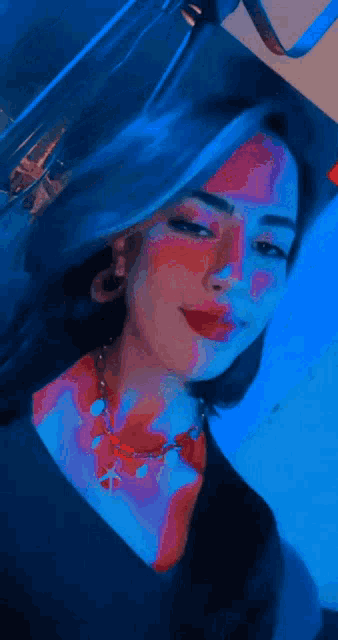 a close up of a woman 's face with her eyes closed .
