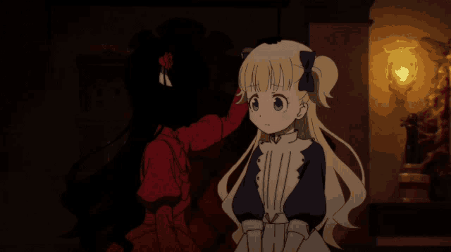 a girl in a red dress and a girl in a blue dress are standing next to each other