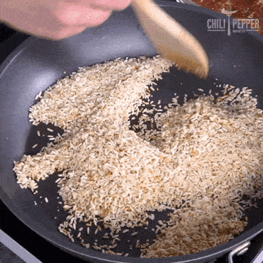 Toasting The Rice Chili Pepper Madness GIF - Toasting The Rice Chili Pepper Madness Stirring The Rice GIFs