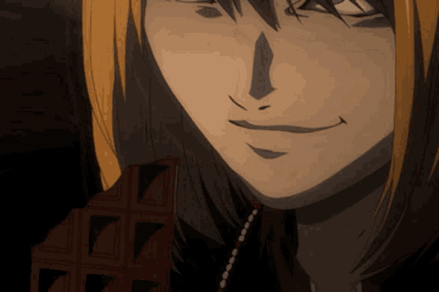 a close up of a person 's face with a smile