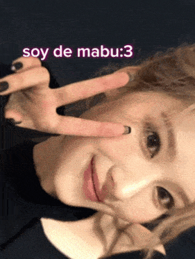 a woman making a peace sign with the words soy de mabu : 3 behind her
