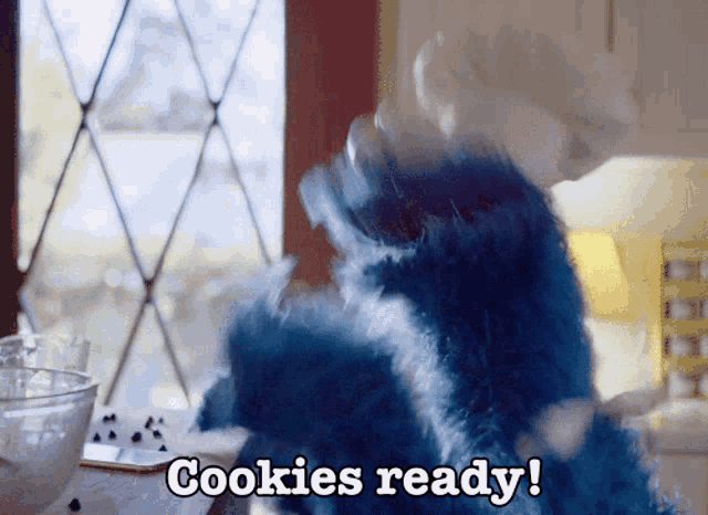 a cookie monster says cookies ready while standing in front of a window