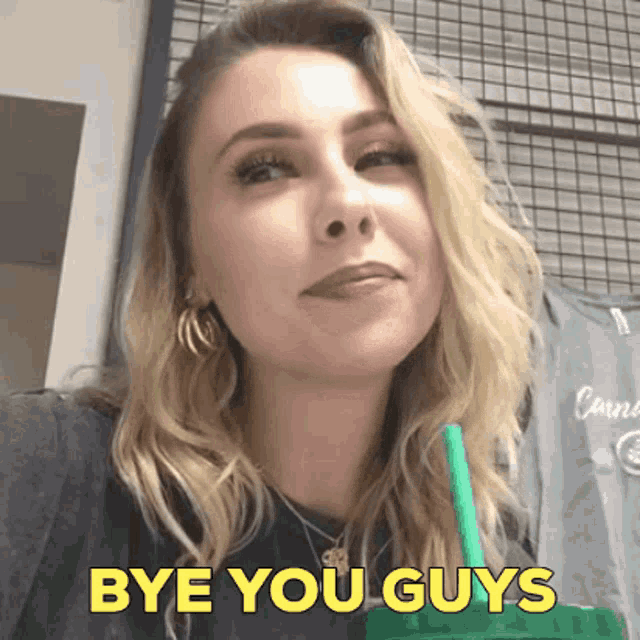 a woman drinking a green drink with the words bye you guys on the bottom