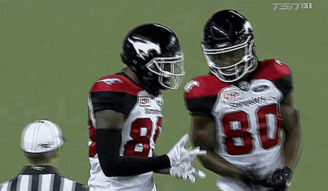 two football players with the number 80 on their jersey