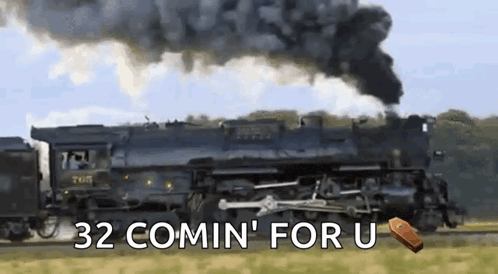 a train with the words 32 comin ' for u on the bottom