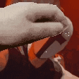 a close up of a person holding a sword with a cross on it .