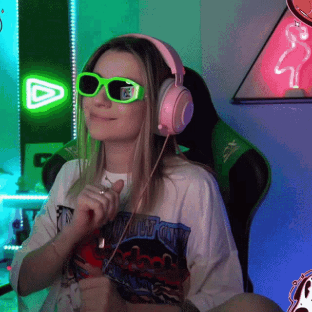 a woman wearing headphones and sunglasses is wearing a shirt that says chicago