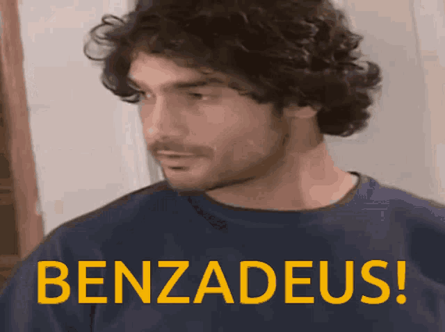 a man in a blue shirt with the word benzadeus written on it