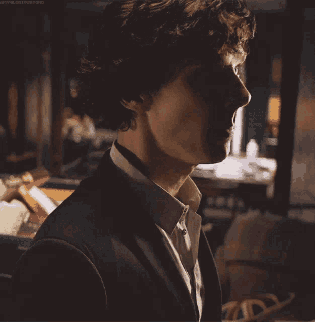 a close up of a man 's face with the word sherlock on the bottom