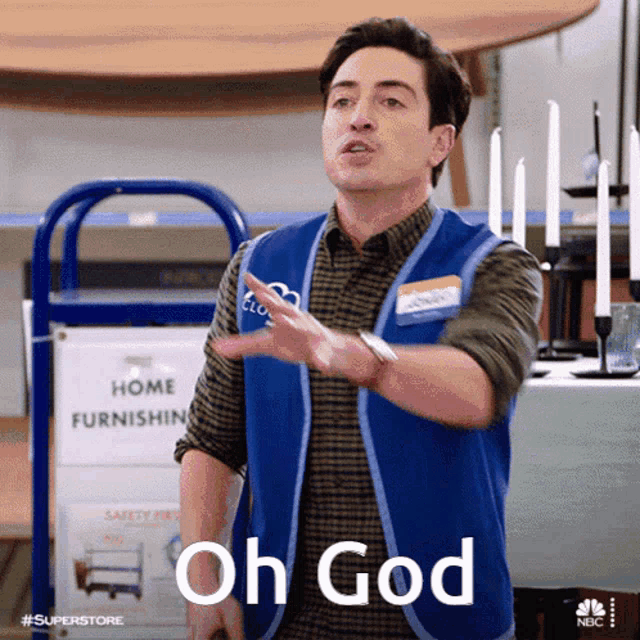 a man wearing a blue vest with the word oh god on it