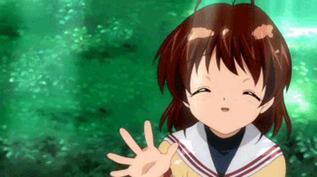 a girl with brown hair is waving her hand