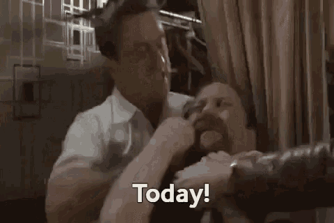 a man in a white shirt is holding another man 's head and says today .