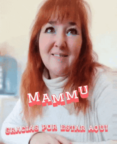 a woman with red hair is smiling and says mammu