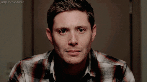 a close up of a man 's face with the words just jensen and dean visible in the corner