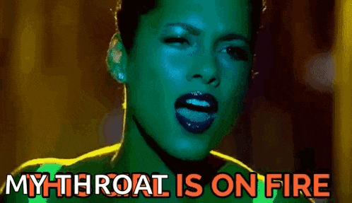 a close up of a woman 's face with the words `` my throat is on fire '' above her .