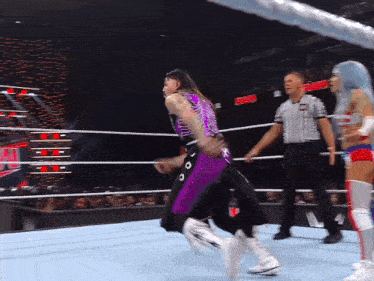 a wrestler in a purple and black outfit with a x on the back